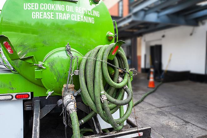 a large grease trap being pumped by a specialist in Columbia Heights, MN